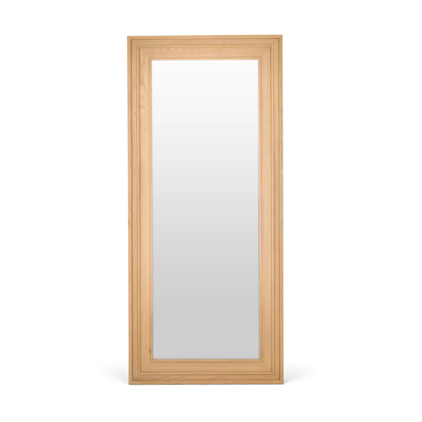 A tall, narrow rectangular wall mirror with a light natural oak wood frame, shown against a plain white background.