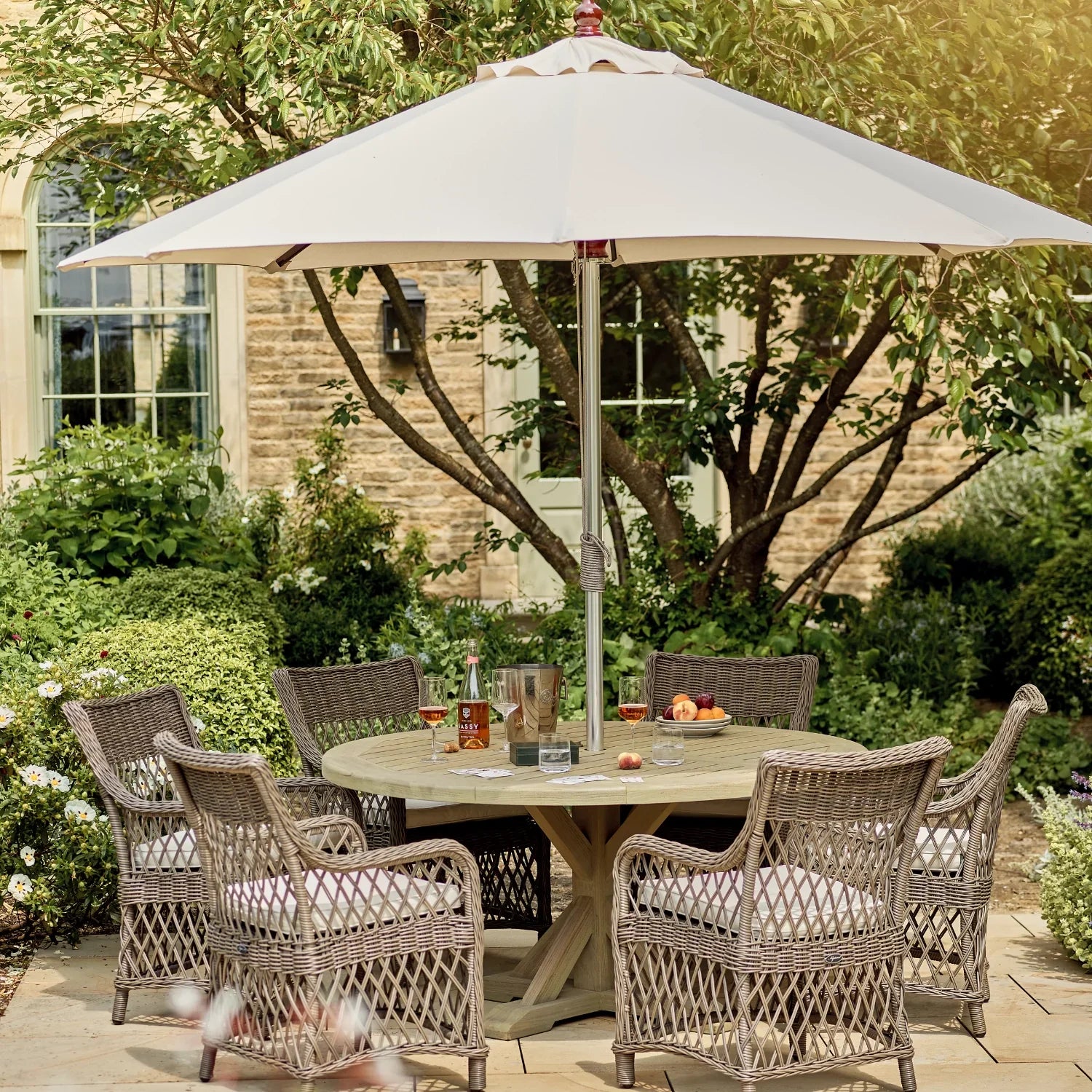 Harmondsworth 6 Seater Round Teak Garden Dining Table Set with Harrington Carver Chairs & Parasol