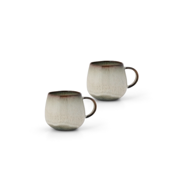 Two ceramic mugs with a textured, speckled glaze in beige and gray, featuring a dark brown rim and handle, set against a plain white background.