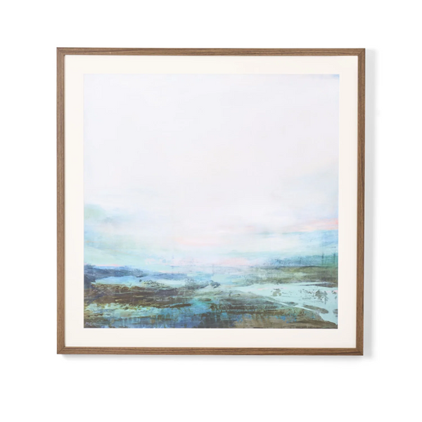 A framed abstract landscape painting featuring soft pastel tones of blue, green, and pink, set in a light brown wood frame with a white mat border against a clean white background.